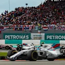 Esteban Ocon (FRA) Force India VJM10 and Felipe Massa (BRA) Williams FW40 battle for position at Formula One World Championship, Rd15, Malaysian Grand Prix, Race, Sepang, Malaysia, Sunday 1 October 2017. © Kym Illman/Sutton Images