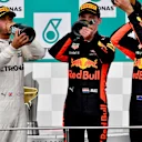 Lewis Hamilton (GBR) Mercedes AMG F1, Max Verstappen (NED) Red Bull Racing and Daniel Ricciardo (AUS) Red Bull Racing celebrate on the podium with the champagne at Formula One World Championship, Rd15, Malaysian Grand Prix, Race, Sepang, Malaysia, Sunday 1 October 2017. © Sutton Images