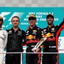 (L to R): Lewis Hamilton (GBR) Mercedes AMG F1, race winner Max Verstappen (NED) Red Bull Racing and Daniel Ricciardo (AUS) Red Bull Racing celebrate on the podium at Formula One World Championship, Rd15, Malaysian Grand Prix, Race, Sepang, Malaysia, Sund