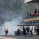 Fire marshals with the car of Marcus Ericsson (SWE) Sauber C36 after retiring from the race with a fire at Formula One World Championship, Rd18, Mexican Grand Prix, Race, Circuit Hermanos Rodriguez, Mexico City, Mexico, Sunday 29 October 2017. © Kym Illman/Sutton Images