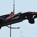 The crashed car of Stoffel Vandoorne (BEL) McLaren MCL32 is craned away in Q2 at Formula One World Championship, Rd6, Monaco Grand Prix, Qualifying, Monte-Carlo, Monaco, Saturday 27 May 2017. © Sutton Images