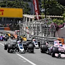 Sergio Perez (MEX) Force India VJM10 and Romain Grosjean (FRA) Haas VF-17 at the start of the race at Formula One World Championship, Rd6, Monaco Grand Prix, Race, Monte-Carlo, Monaco, Sunday 28 May 2017. © Sutton Images