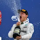 Vettel Ferrari and Race winner Bottas Mercedes celebrate on the podium with the champagne at Formula One World Championship, Rd4, Russian Grand Prix, Race, Sochi Autodrom, Sochi, Krasnodar Krai, Russia, Sunday 30 April 2017. © Sutton Motorsport Images