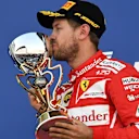 Sebastian Vettel (GER) Ferrari celebrates on the podium with the trophy at Formula One World Championship, Rd4, Russian Grand Prix, Race, Sochi Autodrom, Sochi, Krasnodar Krai, Russia, Sunday 30 April 2017. © Sutton Motorsport Images