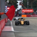 Jolyon Palmer (GBR) Renault Sport F1 Team RS17 and Marshal waves a red flag in FP3 at Formula One World Championship, Rd14, Singapore Grand Prix, Qualifying, Marina Bay Street Circuit, Singapore, Saturday 16 September 2017. © Sutton Images