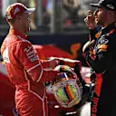Pole sitter Sebastian Vettel (GER) Ferrari and Daniel Ricciardo (AUS) Red Bull Racing in parc ferme at Formula One World Championship, Rd14, Singapore Grand Prix, Qualifying, Marina Bay Street Circuit, Singapore, Saturday 16 September 2017. © Sutton Images