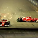 Sebastian Vettel (GER) Ferrari SF70-H leads at the start of the race and the cars of Kimi Raikkonen (FIN) Ferrari SF70-H and Max Verstappen (NED) Red Bull Racing RB13 crash after colliding at Formula One World Championship, Rd14, Singapore Grand Prix, Rac