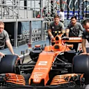 McLaren mechanics push McLaren MCL32 at Formula One World Championship, Rd14, Singapore Grand Prix, Preparations, Marina Bay Street Circuit, Singapore, Thursday 14 September 2017. © Sutton Images