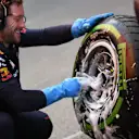 Red Bull Racing mechanic washes Pirelli tyres and wheels at Formula One Testing, Day Four, Barcelona, Spain, 2 March 2017. © Sutton Images