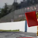 Marshal with red flag at Formula One Testing, Day Four, Barcelona, Spain, 10 March 2017. © Sutton Images