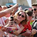Romain Grosjean, Haas F1 Team taks a selfie with a fan at Formula One World Championship, Rd21, Abu Dhabi Grand Prix, Qualifying, Yas Marina Circuit, Abu Dhabi, UAE, Saturday 24 November 2018.