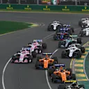 Carlos Sainz jr (ESP) Renault Sport F1 Team RS18 and Fernando Alonso (ESP) McLaren MCL33 at the start of the race at Formula One World Championship, Rd1, Australian Grand Prix, Race, Melbourne, Australia, Sunday 25 March 2018. © Mark Sutton/Sutton Images