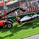 The car of Romain Grosjean (FRA) Haas VF-18 is recovered at Formula One World Championship, Rd1, Australian Grand Prix, Race, Melbourne, Australia, Sunday 25 March 2018. © Jerry Andre/Sutton Images