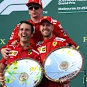 Race winner Sebastian Vettel (GER) Ferrari celebrates on the podium with Kimi Raikkonen (FIN) Ferrari and the trophies at Formula One World Championship, Rd1, Australian Grand Prix, Race, Melbourne, Australia, Sunday 25 March 2018. © Mark Sutton/Sutton Images