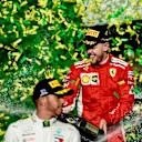 Lewis Hamilton (GBR) Mercedes-AMG F1 and Sebastian Vettel (GER) Ferrari celebrate on the podium with the champagne at Formula One World Championship, Rd1, Australian Grand Prix, Race, Melbourne, Australia, Sunday 25 March 2018. © Jery Andre/Sutton Images