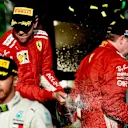 Sebastian Vettel (GER) Ferrari and Kimi Raikkonen (FIN) Ferrari celebrate on the podium with the champagne at Formula One World Championship, Rd1, Australian Grand Prix, Race, Melbourne, Australia, Sunday 25 March 2018. © Jery Andre/Sutton Images