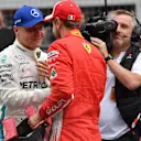 Pole sitter Valtteri Bottas (FIN) Mercedes-AMG F1 and Sebastian Vettel (GER) Ferrari celebrate in parc ferme at Formula One World Championship, Rd9, Austrian Grand Prix, Qualifying, Spielberg, Austria, Saturday 30 June 2018. © Jerry Andre/Sutton Images
