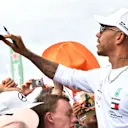 Lewis Hamilton (GBR) Mercedes-AMG F1 and young fan at Formula One World Championship, Rd9, Austrian Grand Prix, Preparations, Spielberg, Austria, Thursday 28 June 2018. © Jerry Andre/Sutton Images
