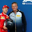 Sebastian Vettel (GER) Ferrari receives the Pole Position Award from Mario Isola (ITA) Pirelli Sporting Director at Formula One World Championship, Rd4, Azerbaijan Grand Prix, Qualifying, Baku City Circuit, Baku, Azerbaijan, Saturday 28 April 2018. © Andy Hone/LAT/Sutton Images