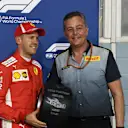 Sebastian Vettel receives the Pirelli award from Mario Isola Pirelli Sporting Director at F1 World Championship, Rd2, Bahrain Grand Prix, Qualifying, Bahrain International Circuit, Sakhir, Bahrain, Saturday 7 April 2018. © Mark Sutton/Sutton Images