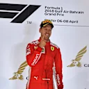 Race winner Sebastian Vettel (GER) Ferrari celebrates on the podium at Formula One World Championship, Rd2, Bahrain Grand Prix, Race, Bahrain International Circuit, Sakhir, Bahrain, Sunday 8 April 2018. © Mark Sutton/Sutton Images