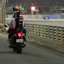 Race Retiree Daniel Ricciardo (AUS) Red Bull Racing gets a lift back to the pits on a motorbike at Formula One World Championship, Rd2, Bahrain Grand Prix, Race, Bahrain International Circuit, Sakhir, Bahrain, Sunday 8 April 2018. © Michael Memmler/Sutton