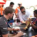 Romain Grosjean (FRA) Haas F1 signs autographs for the fans at Formula One World Championship, Rd2, Bahrain Grand Prix, Race, Bahrain International Circuit, Sakhir, Bahrain, Sunday 8 April 2018. © Simon Galloway/Sutton Images