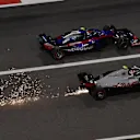 Kevin Magnussen (DEN) Haas VF-18 and Pierre Gasly (FRA) Scuderia Toro Rosso STR13 and sparks at Formula One World Championship, Rd2, Bahrain Grand Prix, Race, Bahrain International Circuit, Sakhir, Bahrain, Sunday 8 April 2018. © Mark Sutton/Sutton Images