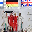 Valtteri Bottas (FIN) Mercedes-AMG F1, Sebastian Vettel (GER) Ferrari and Lewis Hamilton (GBR) Mercedes-AMG F1 celebrate on the podium at Formula One World Championship, Rd2, Bahrain Grand Prix, Race, Bahrain International Circuit, Sakhir, Bahrain, Sunday 8 April 2018. © Mark Sutton/Sutton Images