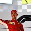 Race winner Sebastian Vettel (GER) Ferrari celebrates on the podium at Formula One World Championship, Rd2, Bahrain Grand Prix, Race, Bahrain International Circuit, Sakhir, Bahrain, Sunday 8 April 2018. © Jerry Andre/Sutton Images