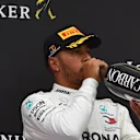 Lewis Hamilton, Mercedes AMG F1 celebrates with the champagne on the podium at Formula One World Championship, Rd13, Belgian Grand Prix, Race, Spa Francorchamps, Belgium, Sunday 26 August 2018. © Jose Rubio/Sutton Images