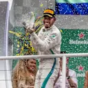 Race winner Lewis Hamilton, Mercedes AMG F1 celebrates on the podium with the champagne at Formula One World Championship, Rd20, Brazilian Grand Prix, Race, Interlagos, Sao Paulo, Brazil, Sunday 11 November 2018.