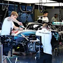 Mercedes AMG F1 mechanics work on the car of Lewis Hamilton (GBR) Mercedes-AMG F1 W09 EQ Power+ in the garage at Formula One World Championship, Rd10, British Grand Prix, Practice, Silverstone, England, Friday 6 July 2018. © Mark Sutton/Sutton Images
