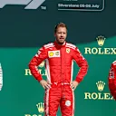 (L to R): Hamilton (GBR) Mercedes-AMG F1, Vettel (GER) Ferrari and Raikkonen (FIN) Ferrari on the podium at Formula One World Championship, Rd10, British Grand Prix, Race, Silverstone, England, Sunday 8 July 2018. © Manuel Goria/Sutton Images