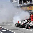 Romain Grosjean (FRA) Haas VF-18 smokes in pit lane in Q1 at Formula One World Championship, Rd7, Canadian Grand Prix, Qualifying, Montreal, Canada, Saturday 9 June 2018. © Mark Sutton/Sutton Images