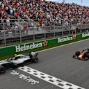 Valtteri Bottas (FIN) Mercedes-AMG F1 W09 EQ Power+ and Max Verstappen (NED) Red Bull Racing RB14 take the chequered flag at Formula One World Championship, Rd7, Canadian Grand Prix, Race, Montreal, Canada, Sunday10 June 2018. © Mark Sutton/Sutton Images