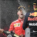 Race winner Vettel (GER) Ferrari and Verstappen (NED) Red Bull Racing celebrate on the podium with the champagne at Formula One World Championship, Rd7, Canadian Grand Prix, Race, Montreal, Canada, Sunday10 June 2018. © Simon Galloway/Sutton Images