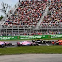 Daniel Ricciardo (AUS) Red Bull Racing RB14 and Kimi Raikkonen (FIN) Ferrari SF-71H battle at the start of the race at Formula One World Championship, Rd7, Canadian Grand Prix, Race, Montreal, Canada, Sunday10 June 2018. © Jerry Andre/Sutton Images
