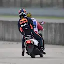 Daniel Ricciardo (AUS) Red Bull Racing stopped on track in FP3 and catches a lift on a scooter at Formula One World Championship, Rd3, Chinese Grand Prix, Qualifying, Shanghai, China, Saturday 14 April 2018. © Simon Galloway/Sutton Images