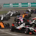 Romain Grosjean (FRA) Haas VF-18 and Fernando Alonso (ESP) McLaren MCL33 at the start of the race at Formula One World Championship, Rd3, Chinese Grand Prix, Race, Shanghai, China, Sunday 15 April 2018. © Mark Sutton/Sutton Images