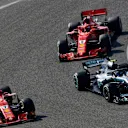 Kimi Raikkonen (FIN) Ferrari SF-71H and Valtteri Bottas (FIN) Mercedes-AMG F1 W09 EQ Power+ battle and Sebastian Vettel (GER) Ferrari SF-71H at Formula One World Championship, Rd3, Chinese Grand Prix, Race, Shanghai, China, Sunday 15 April 2018. © Jerry Andre/Sutton Images