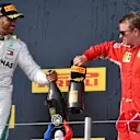 Race winner Lewis Hamilton (GBR) Mercedes-AMG F1 and Kimi Raikkonen (FIN) Ferrari celebrate on the podium with the champagne at Formula One World Championship, Rd8, French Grand Prix, Race, Paul Ricard, France, Sunday 24 June 2018. © Mark Sutton/Sutton Images