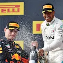 Max Verstappen (NED) Red Bull Racing and Lewis Hamilton (GBR) Mercedes-AMG F1 celebrate on the podium with the champagne at Formula One World Championship, Rd8, French Grand Prix, Race, Paul Ricard, France, Sunday 24 June 2018. © Mark Sutton/Sutton Images