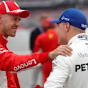 Pole sitter Sebastian Vettel (GER) Ferrari celebrates in parc ferme with Valtteri Bottas (FIN) Mercedes-AMG F1 at Formula One World Championship, Rd11, German Grand Prix, Qualifying, Hockenheim, Germany, Saturday 21 July 2018. © Steven Tee/LAT/Sutton Images