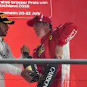 Lewis Hamilton (GBR) Mercedes-AMG F1 and Kimi Raikkonen (FIN) Ferrari celebrate on the podium with the champagne at Formula One World Championship, Rd11, German Grand Prix, Race, Hockenheim, Germany, Sunday 22 July 2018. © Mark Sutton/Sutton Images