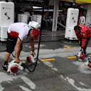 Alfa Romeo Sauber F1 Team mechanics dry the pit box at Formula One World Championship, Rd12, Hungarian Grand Prix, Qualifying, Hungaroring, Hungary, Saturday 28 July 2018. © Mark Sutton/Sutton Images