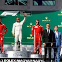 Sebastian Vettel (GER) Ferrari, Lewis Hamilton (GBR) Mercedes-AMG F1 and Kimi Raikkonen (FIN) Ferrari celebrate on the podium at Formula One World Championship, Rd12, Hungarian Grand Prix, Race, Hungaroring, Hungary, Sunday 29 July 2018. © Manuel Goria/Sutton Images
