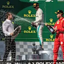 Lewis Hamilton (GBR) Mercedes-AMG F1 and Sebastian Vettel (GER) Ferrari celebrate on the podium with the champagne at Formula One World Championship, Rd12, Hungarian Grand Prix, Race, Hungaroring, Hungary, Sunday 29 July 2018. © Manuel Goria/Sutton Images