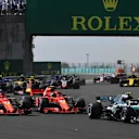 Valtteri Bottas (FIN) Mercedes-AMG F1 W09 EQ Power+, Sebastian Vettel (GER) Ferrari SF-71H and Kimi Raikkonen (FIN) Ferrari SF-71H at the start of the race at Formula One World Championship, Rd12, Hungarian Grand Prix, Race, Hungaroring, Hungary, Sunday 29 July 2018. © Mark Sutton/Sutton Images