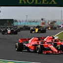 Sebastian Vettel (GER) Ferrari SF-71H and Kimi Raikkonen (FIN) Ferrari SF-71H battle at Formula One World Championship, Rd12, Hungarian Grand Prix, Race, Hungaroring, Hungary, Sunday 29 July 2018. © Mark Sutton/Sutton Images